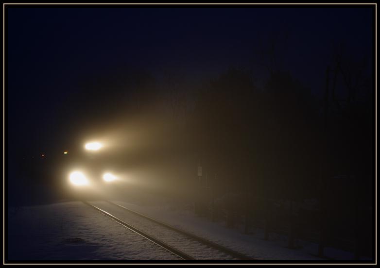 Commuter train on the way to Boston through the fog on New Year's Eve. A few seconds later, I took this shot of the same train.