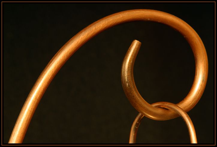 Detail of a copper candle holder.