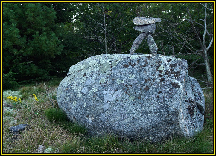 A small pile of balanced rocks found on a hilltop in the woods of Essex, Massachusetts (US).