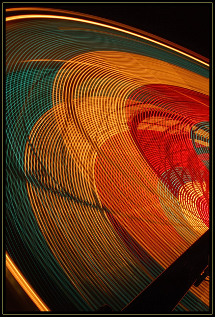 Closeup of a spinning ferris wheel at night at the Topsfield Fair in Topsfield, Massachusetts (US). The long exposure made interesting light trails.