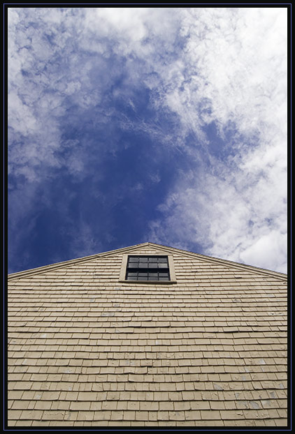 Looking up at an old barn on a summer day.