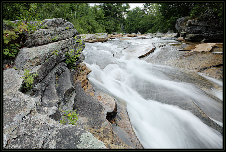 A portion of the Lower Ammonoosuc Falls near Carroll, NH. Taken under heavy clouds in a light summer rain.

44.2697,-71.4822